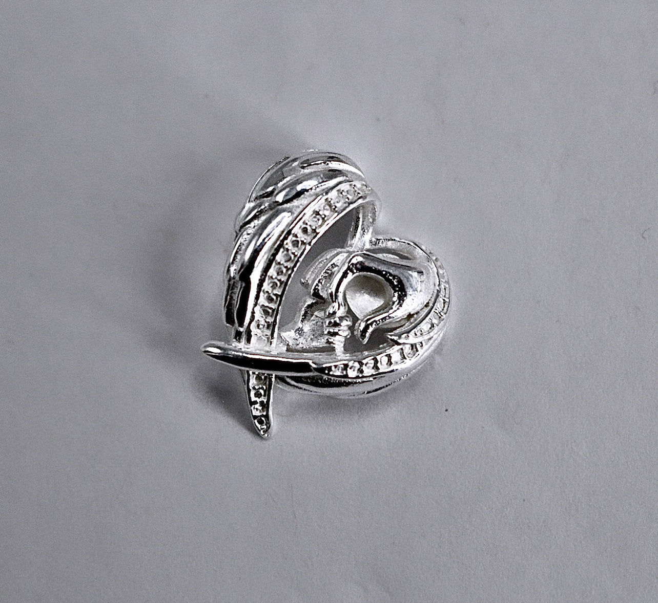 WINGS & MOM HOLDING BABIES HAND