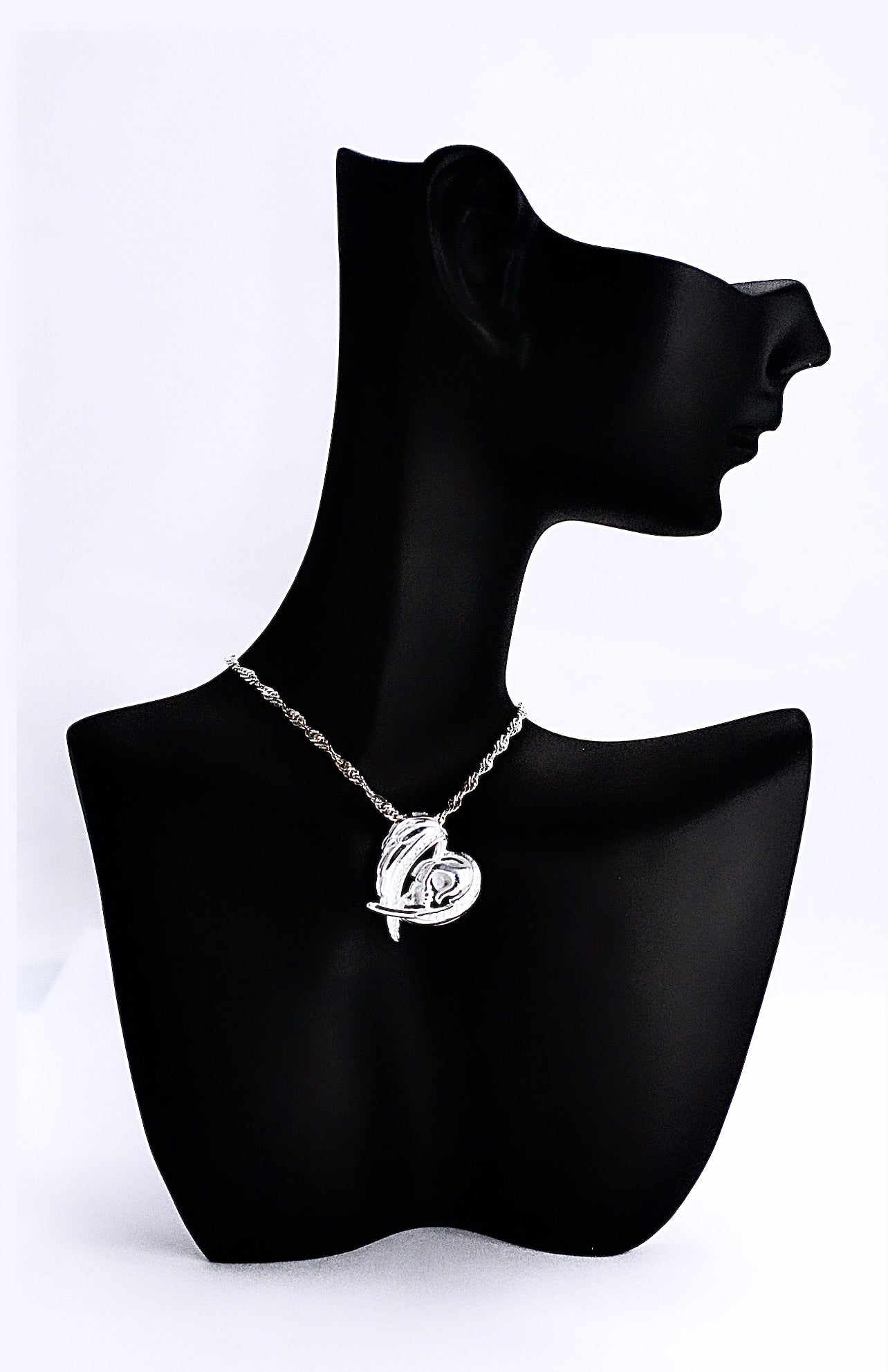 WINGS & MOM HOLDING BABIES HAND